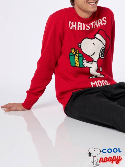 Stay stylish with a women's crewneck black sweater featuring Snoopy and Woodstock print and rhinestones